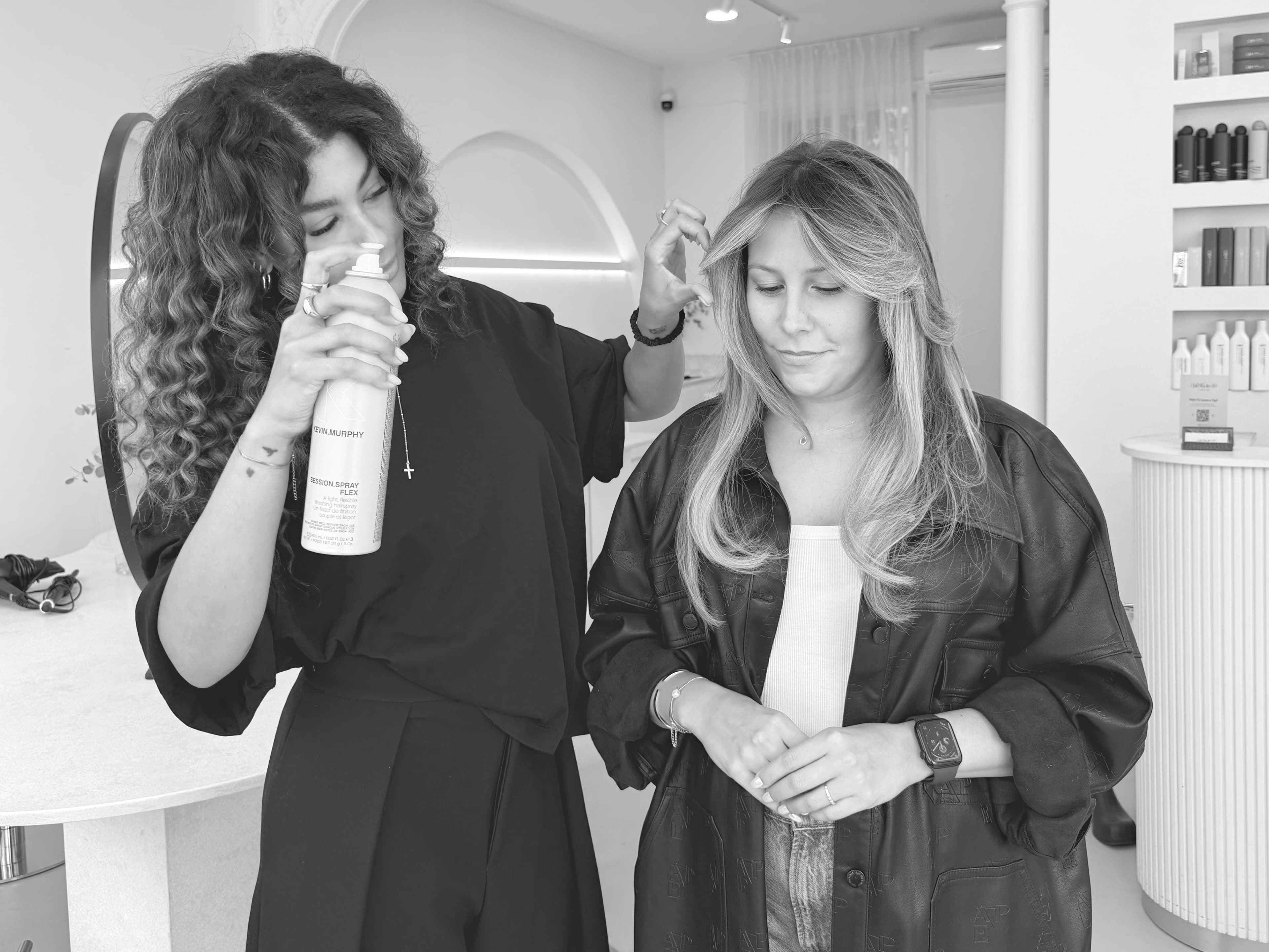Araceli Perez finishing a client's hair at HairStudio 89